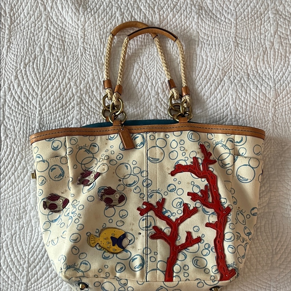 Vintage Coach tote bag featuring a playful underwater theme.